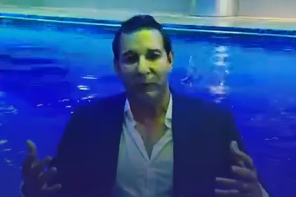 Wasim Akram hits back at trolls by swimming in three-piece suit